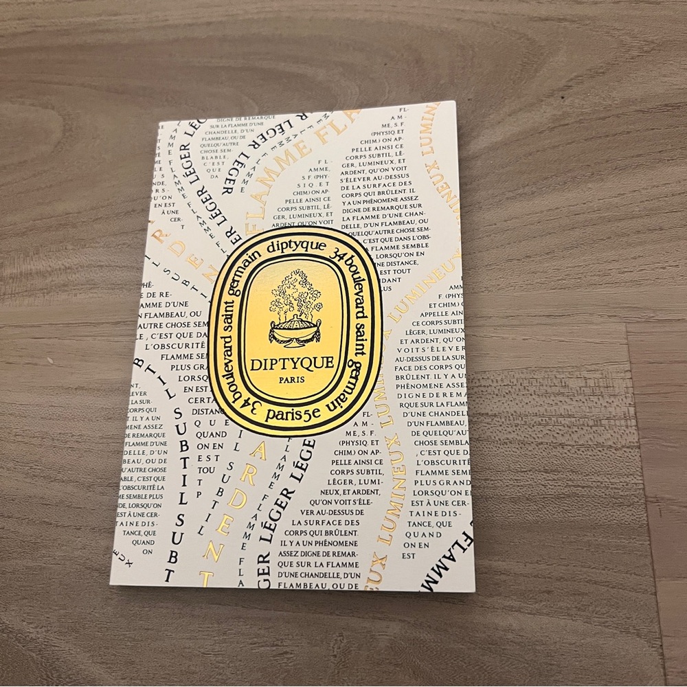 Diptyque Paris Booklet with Black, White, and Yellow Design